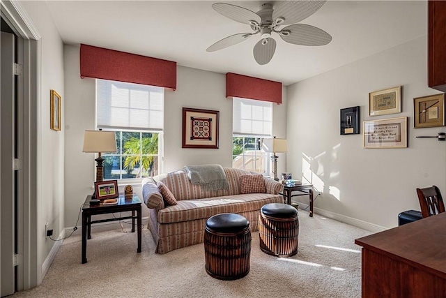 living room with ceiling fan and light carpet