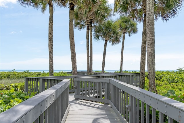 wooden deck featuring a water view