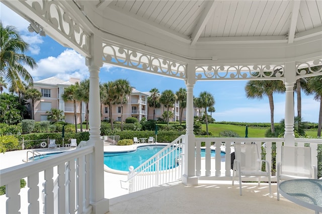 view of swimming pool with a gazebo and a patio area