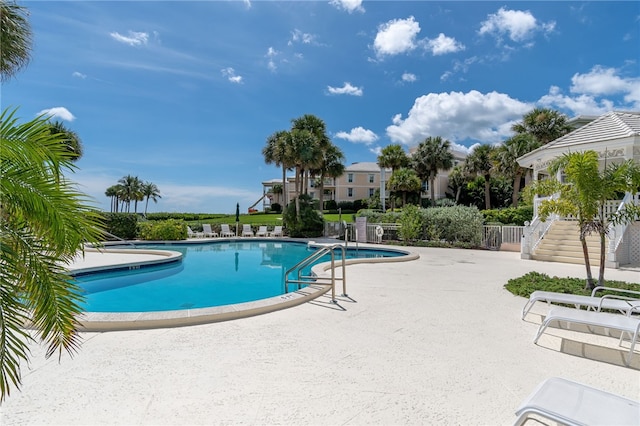 view of swimming pool with a patio