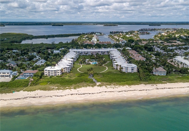 birds eye view of property featuring a water view and a view of the beach