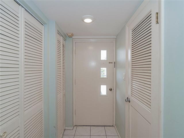 doorway to outside featuring light tile patterned floors