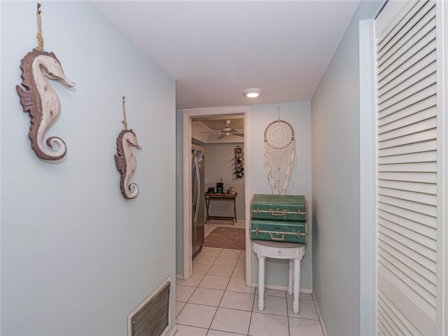 corridor featuring light tile patterned flooring