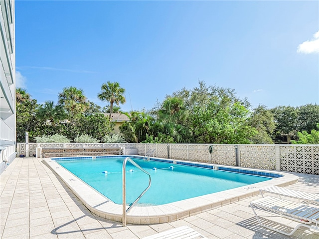 view of pool featuring a patio