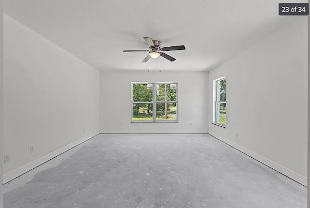 unfurnished room with ceiling fan