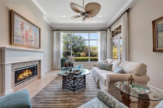 1300 Lake Bend Ct, Vero Beach, FL 32963 - living area with crown molding, baseboards, a tile fireplace, ceiling fan, and recessed lighting