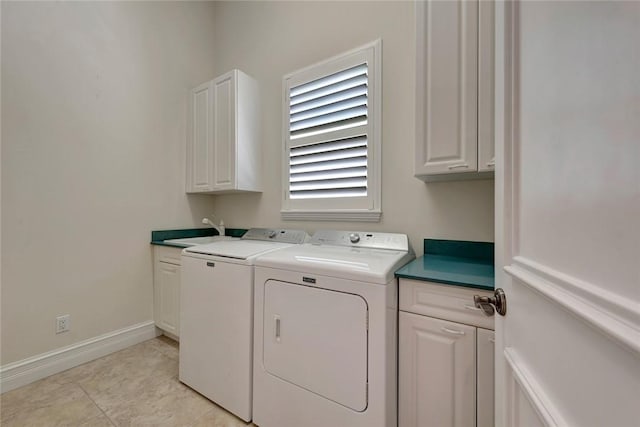 1300 Lake Bend Ct, Vero Beach, FL 32963 - laundry room with washer and dryer, cabinet space, and baseboards