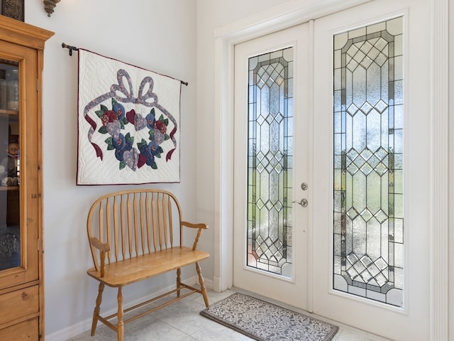 tiled foyer featuring french doors