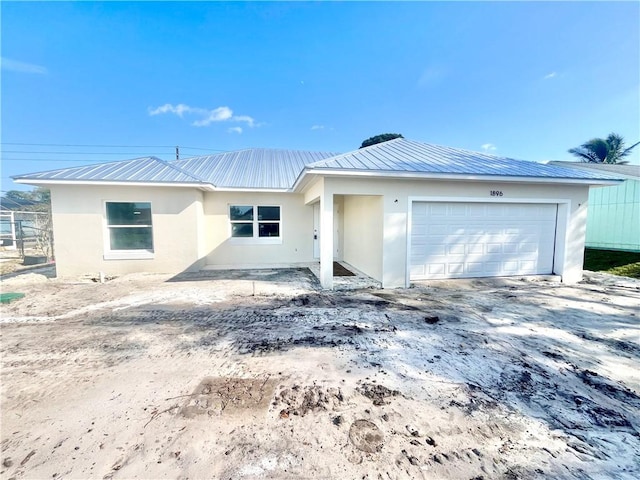 single story home with a garage