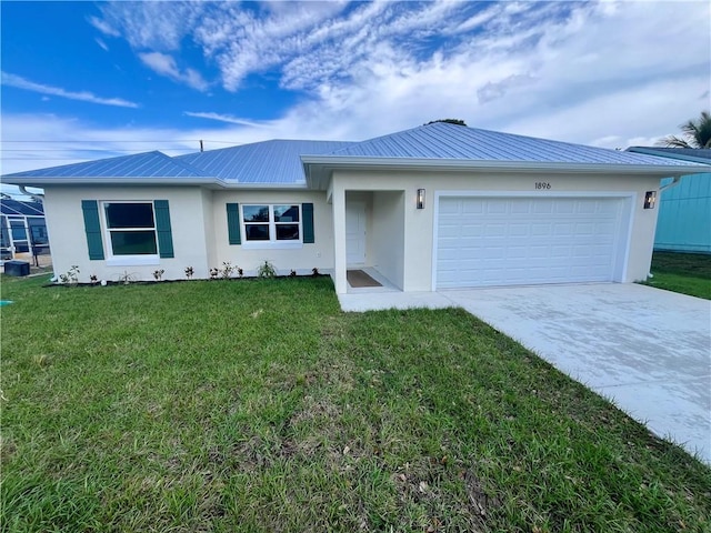 ranch-style home with stucco siding, metal roof, a garage, driveway, and a front lawn