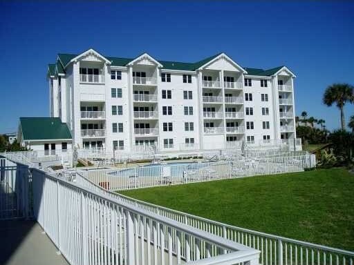 view of property featuring a community pool