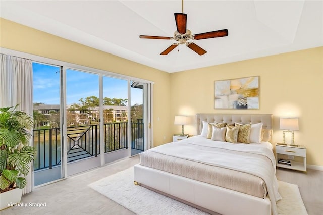 bedroom with ceiling fan and access to outside