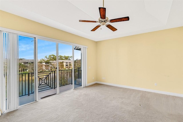 empty room with ceiling fan and carpet