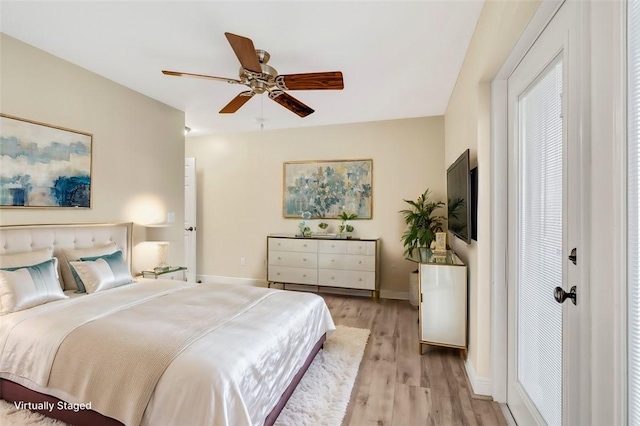 bedroom featuring ceiling fan and light hardwood / wood-style floors