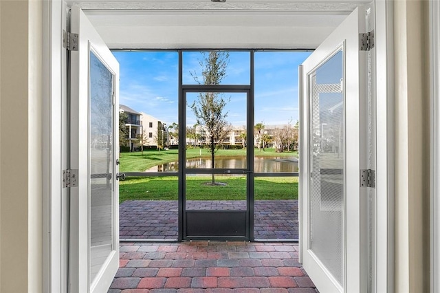 entryway with a water view