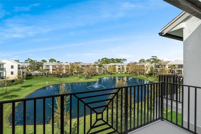 balcony featuring a water view