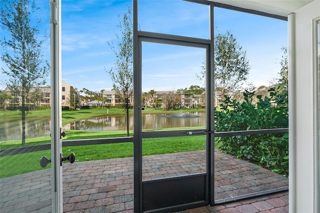 entryway with a healthy amount of sunlight and a water view