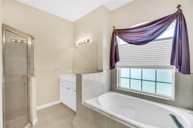 bathroom with plus walk in shower, tile patterned flooring, and vanity