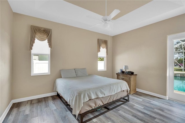 bedroom featuring light wood-type flooring and ceiling fan