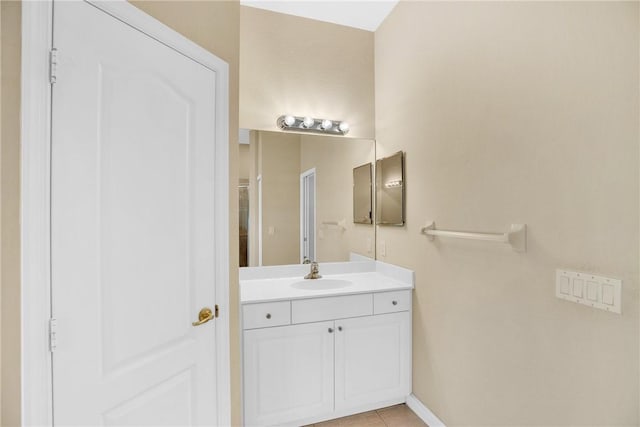 bathroom with tile patterned flooring and vanity