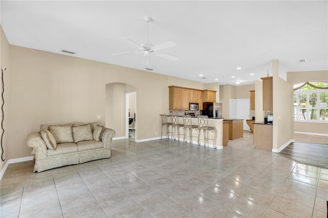 living room with ceiling fan