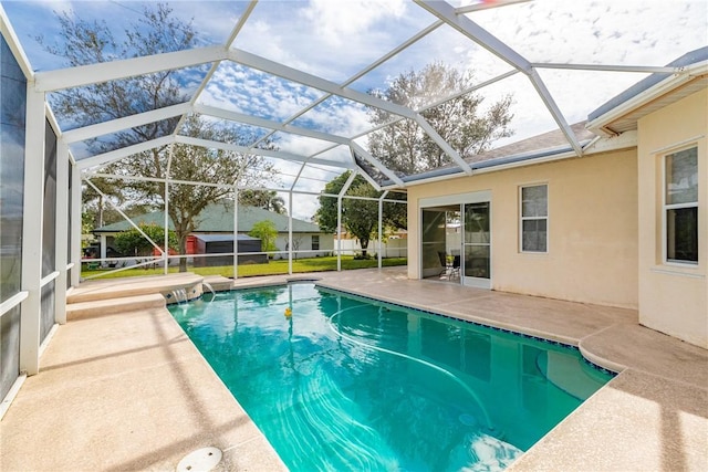 view of pool featuring a lanai and a patio area