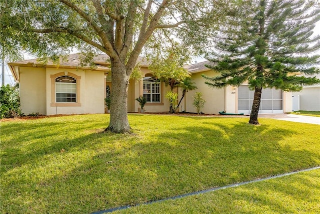 ranch-style house with a front yard and a garage