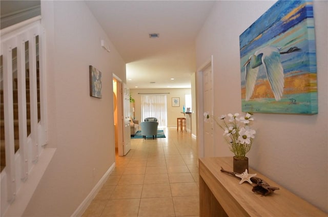 1073 Cheval Dr, Vero Beach, FL 32960 - hallway with light tile patterned floors, baseboards, and recessed lighting