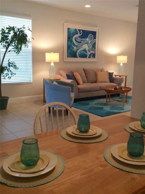 1073 Cheval Dr, Vero Beach, FL 32960 - tiled dining area featuring baseboards and recessed lighting