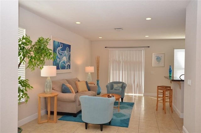 1073 Cheval Dr, Vero Beach, FL 32960 - living area with light tile patterned flooring, recessed lighting, and baseboards