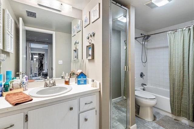 1170 6th Ave Unit 9D, Vero Beach, FL 32960 - bathroom featuring vanity, toilet, shower / tub combo with curtain, and tile patterned flooring