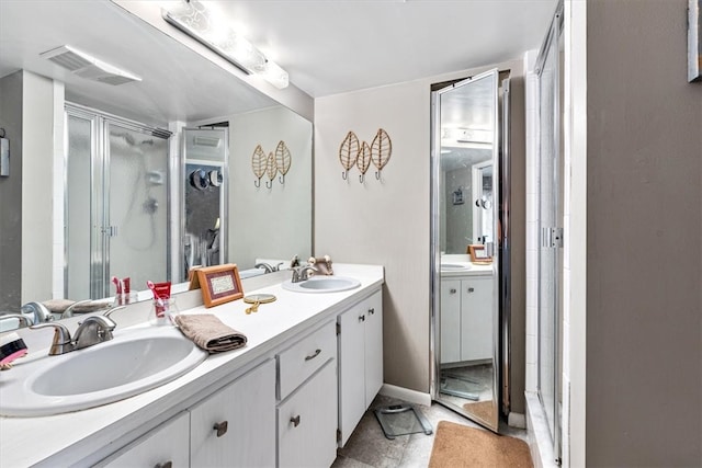 bathroom with a shower with door and vanity