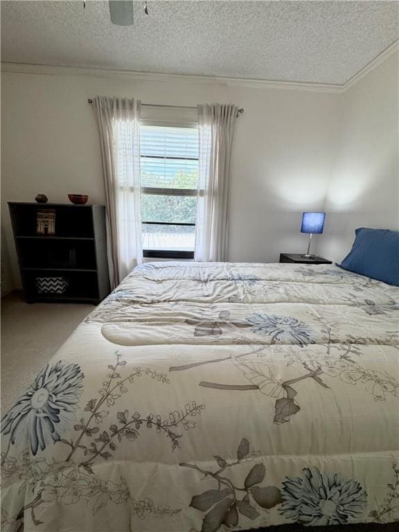 carpeted bedroom featuring ceiling fan, crown molding, and a textured ceiling