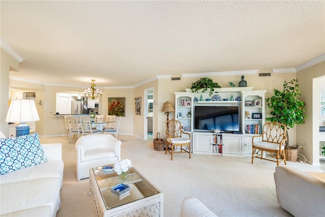 living room featuring ornamental molding, a chandelier, and a textured ceiling