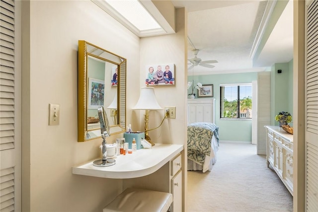 bathroom featuring crown molding and ceiling fan