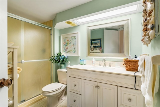 bathroom featuring an enclosed shower, vanity, tile patterned floors, and toilet