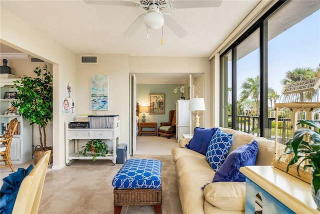 sunroom / solarium with ceiling fan