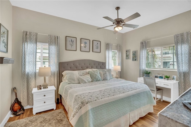 bedroom featuring hardwood / wood-style flooring and ceiling fan