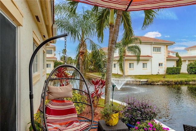 balcony featuring a water view