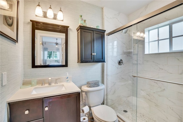 bathroom with vanity, toilet, and walk in shower