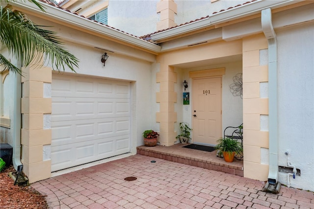 entrance to property featuring a garage