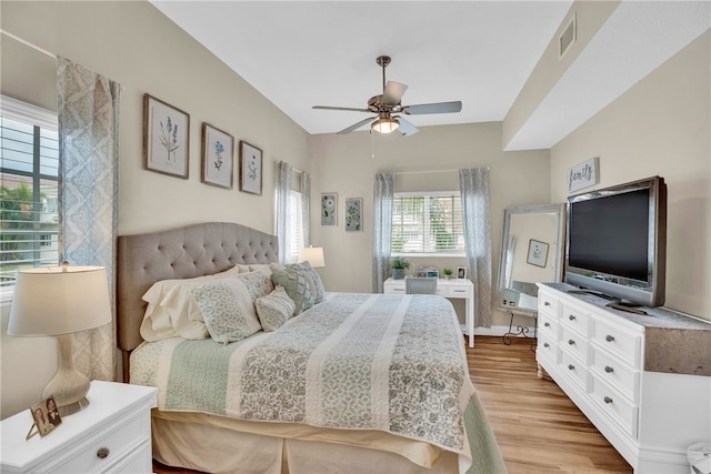 bedroom with ceiling fan and light wood-type flooring