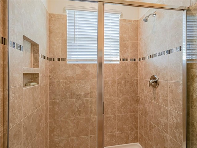 bathroom with a shower stall