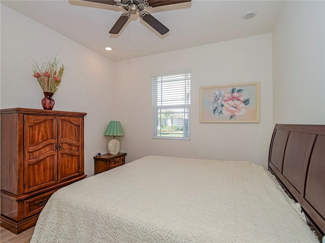 bedroom featuring recessed lighting, light wood-style flooring, and a ceiling fan