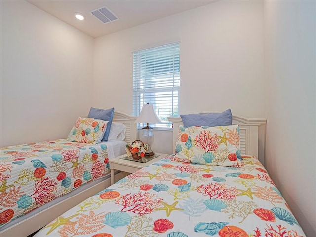 bedroom with recessed lighting and visible vents