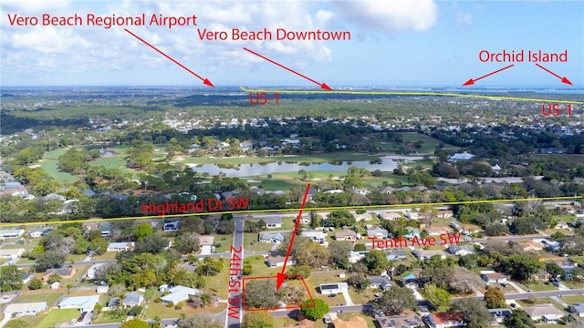 birds eye view of property featuring a residential view and a water view