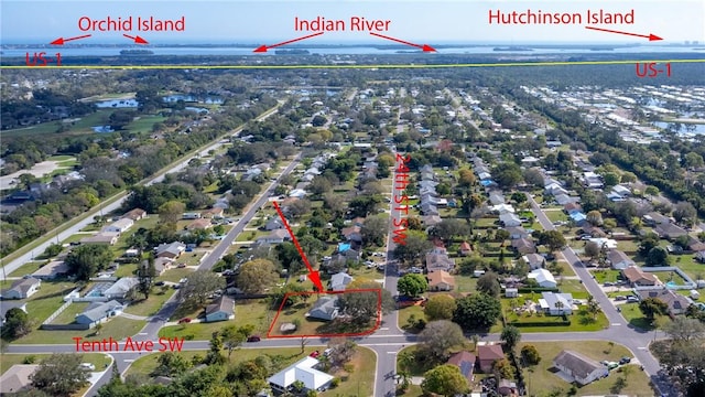 bird's eye view featuring a residential view and a water view