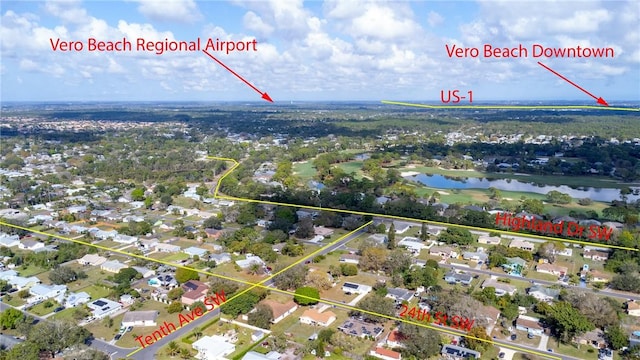 aerial view featuring a water view and a residential view