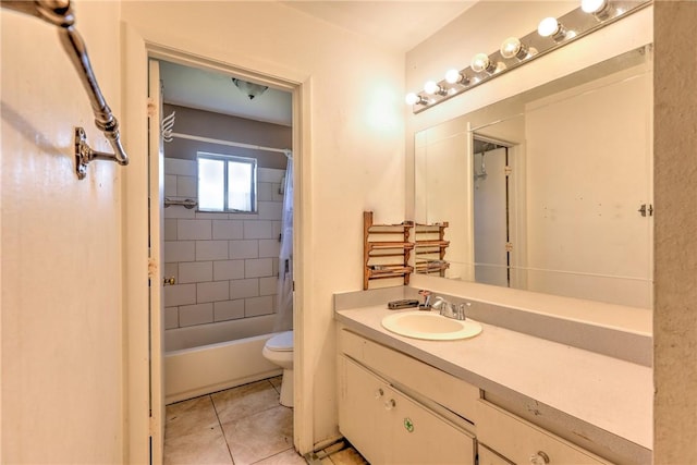 bathroom featuring shower / bath combo with shower curtain, vanity, toilet, and tile patterned floors