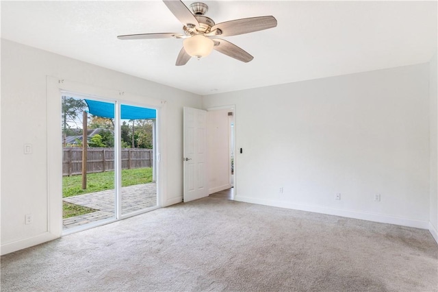 spare room featuring carpet and ceiling fan